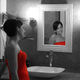 Didier Harmant - Jeune femme en rouge dans salle de bain